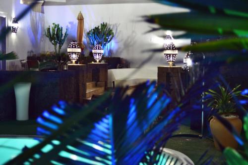 a room with a bunch of plants and lights at Finca del Moral in Tinajo