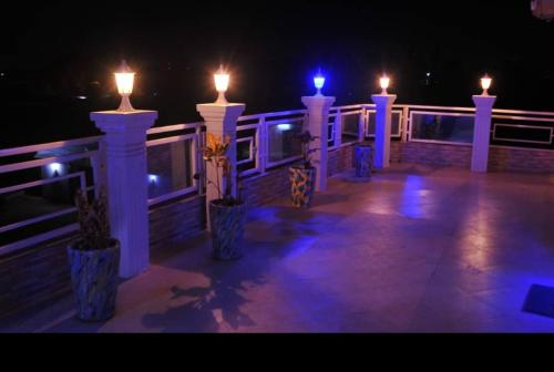 a group of candles on a deck at night at RÉSIDENCE K&K - Lomé-Kégué-Kpatcha in Kopégan