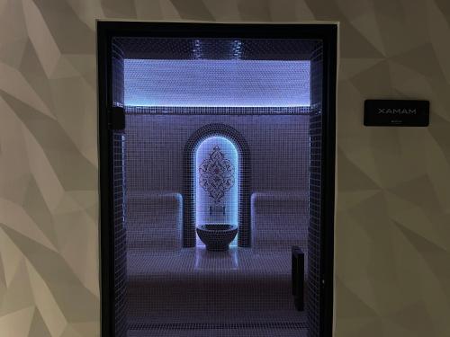 a doorway to a room with a toilet in it at BAYKA - SPA resort in Kosiv