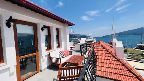 a balcony of a house with a view of the water at Vista House Marmaris in Marmaris