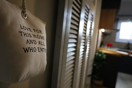 a sign that says love for this home and ah who ever at Marina Zeas Seaside Studio-MarinaQ in Piraeus