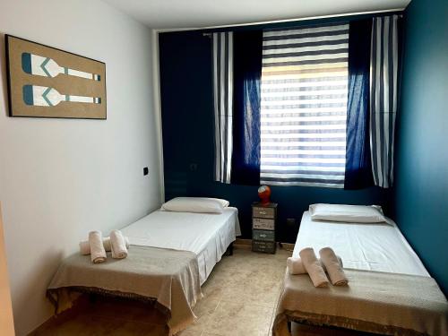 Postel nebo postele na pokoji v ubytování Golden Beach Sant Carles de La Ràpita