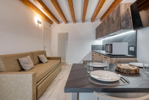 a living room with a couch and a table at Concilium in Trento