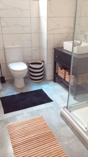 a bathroom with a toilet and a sink at Valletta Archbishop 2 in Valletta