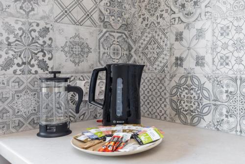 a blender on a counter with a plate of food at Seaside Escape Pet Friendly Apartments Mielenko by Noclegi Renters in Mielenko