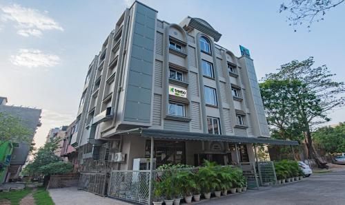 a tall building with a sign on the front of it at Treebo Gyani's in Jamshedpur