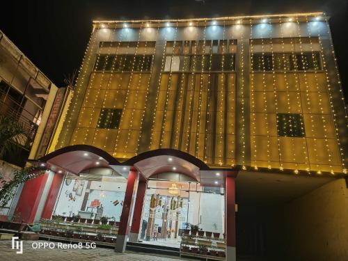 a large building with lights on top of it at OYO Flagship Hotel Amarpali in Baddi