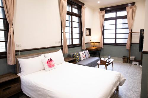 Cama o camas de una habitación en 櫻花樹夏民宿