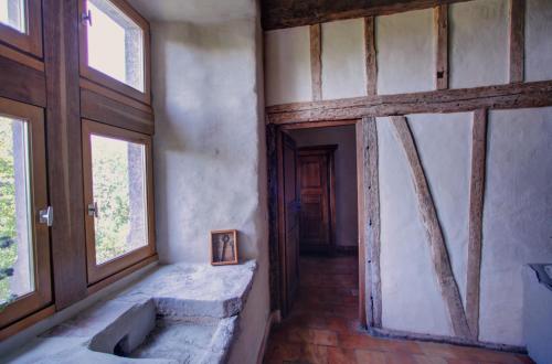 a bathroom with a sink in a room with windows at Château de Mézerville in Mézerville