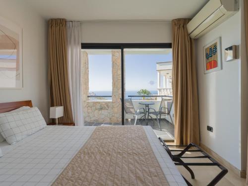 Ένα ή περισσότερα κρεβάτια σε δωμάτιο στο Mirador del Mar Villas