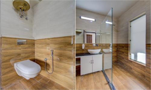 a bathroom with a toilet and a sink and a shower at Treebo Down Town, Dalhousie in Dalhousie