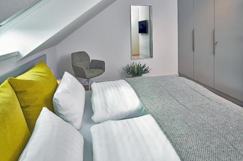 Giường trong phòng chung tại Lüttjeod Apartmentvilla Lüttjeod Apartmentvilla 15