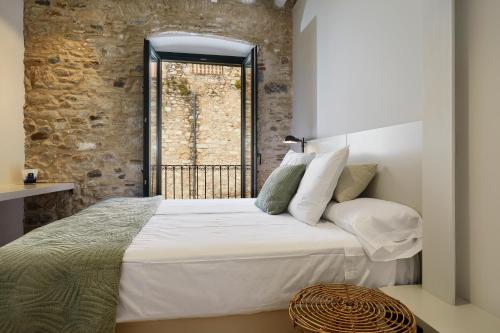 Letto o letti in una camera di Canvas Apartments & Lofts Girona