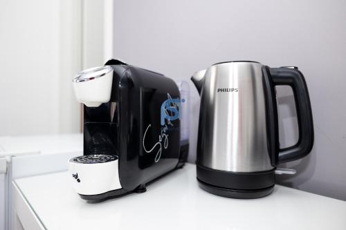 two coffeemakers sitting on top of a counter at Il Vittoria - Self Check in in Lascari