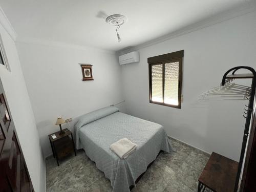 Ένα ή περισσότερα κρεβάτια σε δωμάτιο στο Casa Rural Guzman