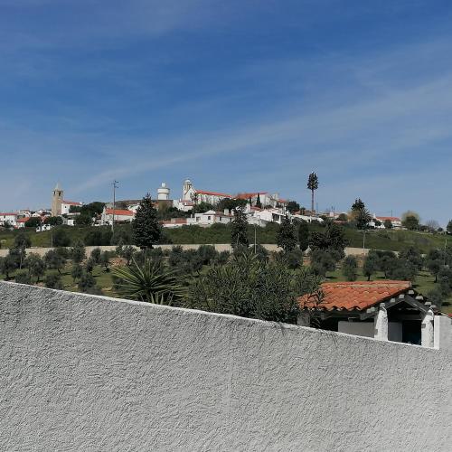 a view of a city from the top of a white wall at Casa do Cabeço - Termas da Sulfúrea in Cabeço de Vide