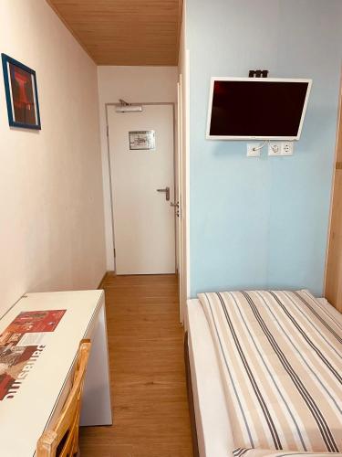 Ένα ή περισσότερα κρεβάτια σε δωμάτιο στο Andefu Hotel am Kantpark