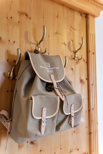 a couple of bags hanging on a wall at Der Verdinser Hof in Schenna