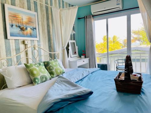 Postel nebo postele na pokoji v ubytování Mooz Huahin Bed & Breakfast