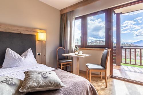 Postel nebo postele na pokoji v ubytování Hotel Arcobaleno