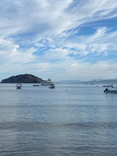 a large body of water with boats in it at Bungalow at the beach all services in Rincon de Guayabitos