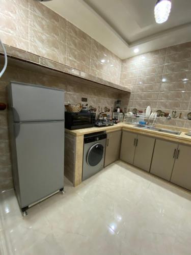 Η κουζίνα ή μικρή κουζίνα στο Résidence Mayssa 1 et Mayssa 2 boujdour appartements meublés