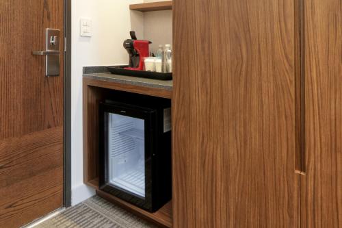 a room with a glass door with a fireplace in it at Culiacan Marriott Hotel in Culiacán
