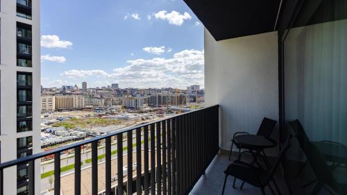 a balcony with a view of a city at Terra Luxe Residences in Sajmište