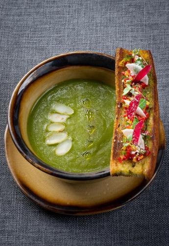 a bowl of soup with a piece of bread and a sandwich at Moksha at Kitulgala - Rainforest Boutique Hotel in Kitulgala