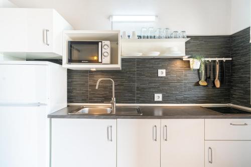Kuchyň nebo kuchyňský kout v ubytování Apartamento Jibazahora Virgo