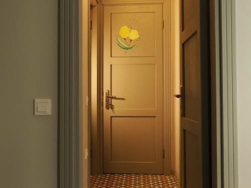 a door with a flower painted on it at Tilas - Rooms in 19th Century Wooden Townhouse,Kadikoy in Istanbul