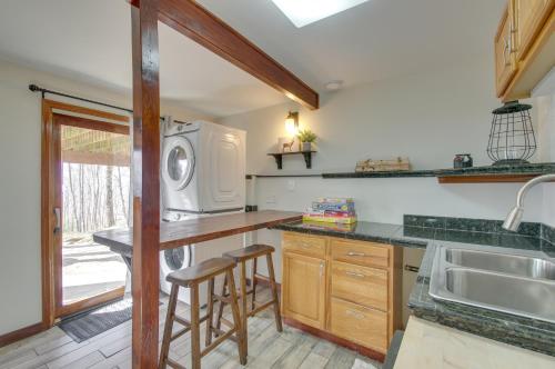 a kitchen with a sink and a microwave at Cozy Hillside Hideaway in Wintergreen Resort! in Lyndhurst