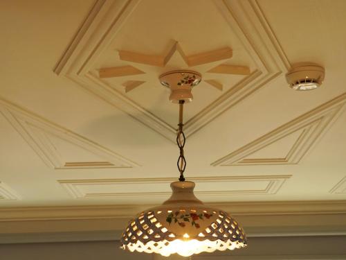 a chandelier hanging from a ceiling at Tilas - Rooms in 19th Century Wooden Townhouse,Kadikoy in Istanbul