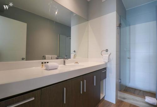 a bathroom with a sink and a mirror at Beautiful 2BR with Terrace in Miraflores in Lima