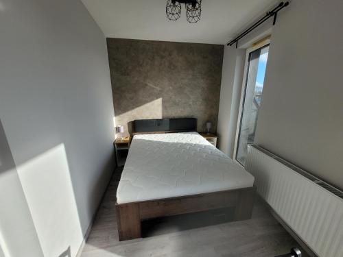 Postel nebo postele na pokoji v ubytování Ferienwohnung Polnische Ostseeküste OceanHome66 a