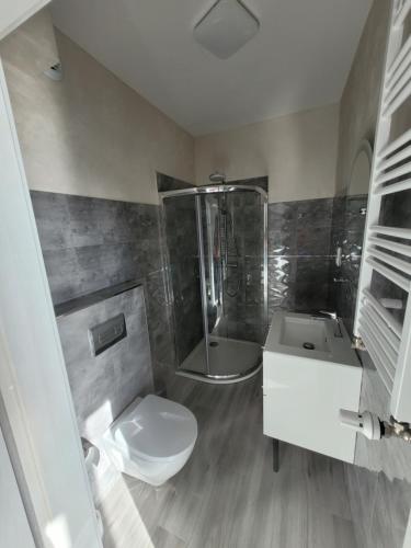 Koupelna v ubytování Ferienwohnung Polnische Ostseeküste OceanHome66 a