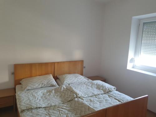 Postel nebo postele na pokoji v ubytování Apartman KEC - Apatin