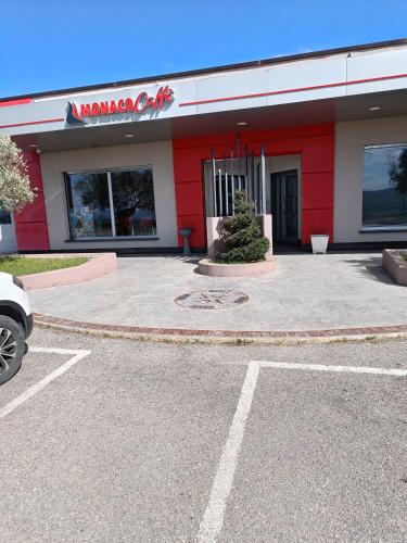 a mobiloco oil store with a car parked in a parking lot at Bed and Breakfast "POGGIO MARANO" in San Bartolomeo in Galdo