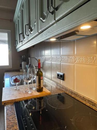 a kitchen with two glasses of wine on a counter at Penthouse in Vejer in Vejer de la Frontera
