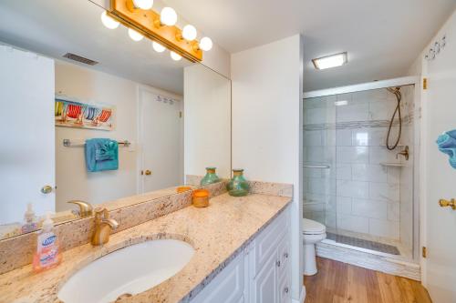 a bathroom with a sink and a shower at Hutchinson Island Vacation Rental with Beach Access! in Fort Pierce