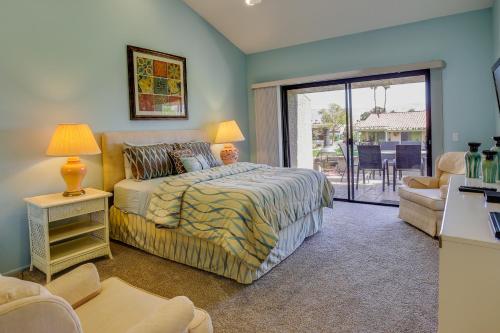 a bedroom with a bed and a living room at Palm Desert Retreat - Patio, Grill and Pool Access! in Palm Desert