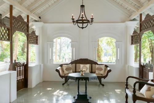 a living room with a couch and a table at Coco Mantra Ilukwehera Estate 