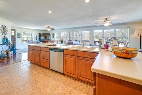 a kitchen with a sink and a counter top at Spacious Vacation Rental Home on Eufaula Lake! in Eufaula