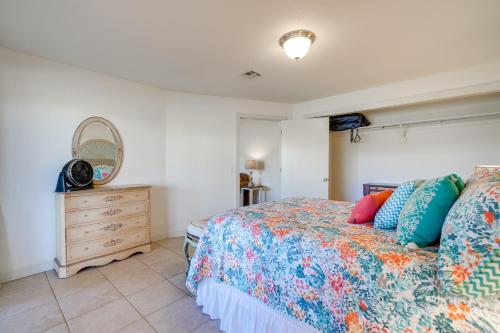 a bedroom with a bed and a dresser at Spacious Vacation Rental Home on Eufaula Lake! in Eufaula