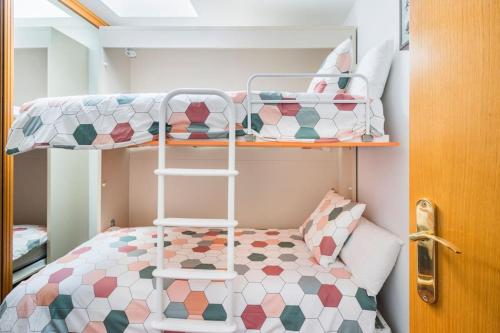 A bed or beds in a room at Dúplex Surf junto a la playa