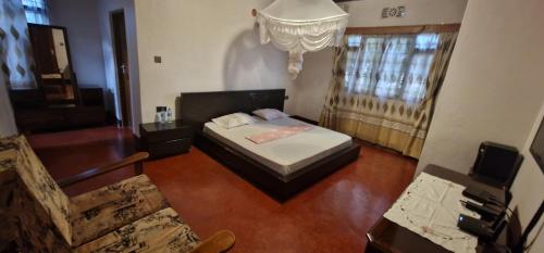 מיטה או מיטות בחדר ב-Gatundu -The Place to be