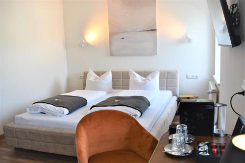 En eller flere senge i et værelse på Black Forest Hotel Kappel-Grafenhausen