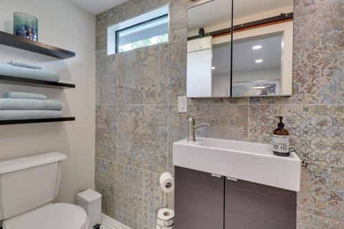 a bathroom with a sink and a toilet at Round Rock Vacation Rental about 22 Mi to Dtwn Austin! in Round Rock