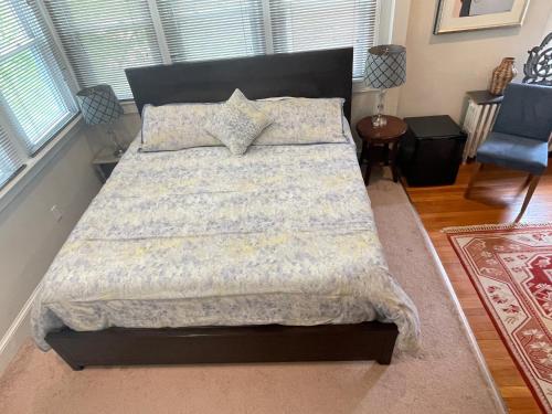 a bedroom with a large bed in a room at Deluxe King Master Suite in Washington, D.C.