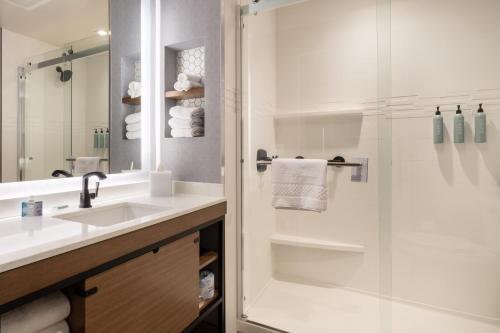 a bathroom with a sink and a shower at Residence Inn by Marriott San Francisco Airport Millbrae Station in Millbrae